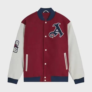 May include: A varsity jacket featuring a deep red body with white sleeves and navy blue ribbed trim at the collar, cuffs, and hem. The front displays a large navy blue letter A patch, while the right sleeve features the numbers 8 and 6 in navy.