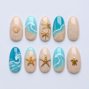 May include: A set of ten oval-shaped press-on nails featuring beach-themed designs. The nails display sandy beige speckled textures, bright turquoise ocean waves with white foam, gold metallic palm trees, starfish, a seashell, and a sea turtle.