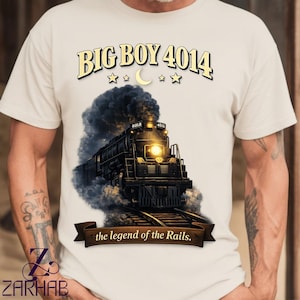 May include: A white ceramic mug with a black handle and the text "But First, Coffee" in a black, bold font. The mug is sitting on a wooden surface. The mug is approximately 4 inches tall.