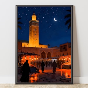 May include: A framed print depicts a nighttime scene of a Moroccan marketplace. The image features a tall, illuminated minaret, stalls with lanterns, and figures walking on a cobblestone street under a starry sky and crescent moon.