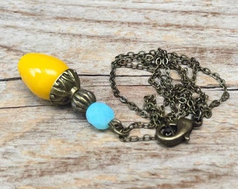 Vintage necklace with drop pendant made of Czech glass beads - yellow turquoise light blue opal & bronze