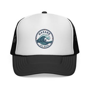 May include: A black and white trucker hat with a white front panel. The front features a circular emblem with the text "NAZARE BIG WAVE" around a blue and white wave design. The hat has a curved brim.