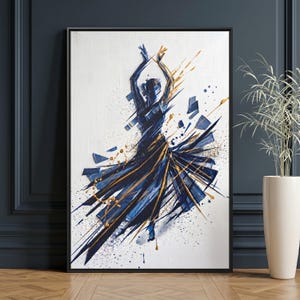 May include: Abstract art print of a dancer in a flowing dress. The artwork features a silhouette in navy blue with gold accents, set against a white background. The dancer's form is captured with dynamic brushstrokes, creating a sense of movement and energy. The print is framed in a black frame.
