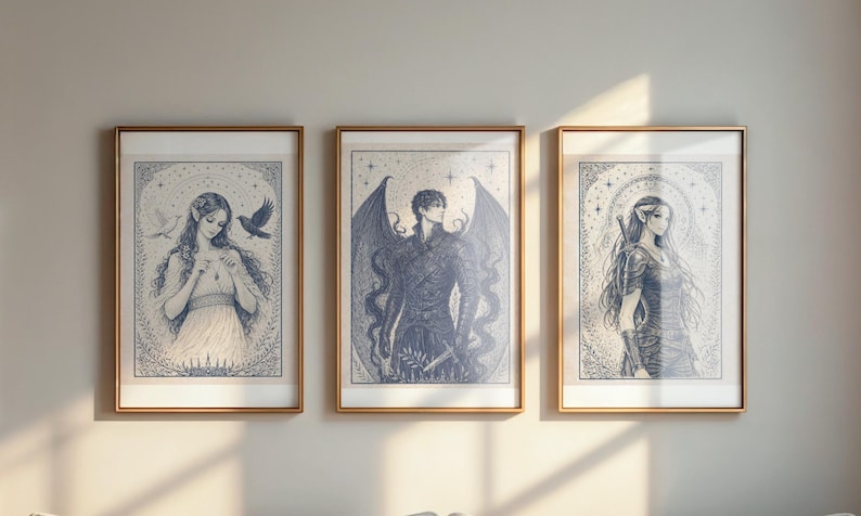 May include: Three framed art prints with gold-colored frames. Each print features a detailed blue and white illustration of a fantasy figure. The artwork includes a woman with birds, a winged figure, and a woman with a sword.