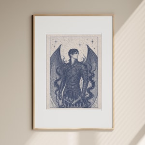 May include: Framed art print featuring a detailed illustration of a figure with large, stylized wings. The artwork is rendered in shades of blue and white, with a celestial background. The figure is holding a sword, and the print is in a gold frame.