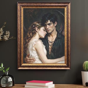 May include: A framed wall art print depicting a romantic scene of a winged figure with dark hair and a black lace-up shirt embracing a person with long wavy hair, pointed ears, and a white dress, all set within an ornate, dark bronze-toned frame.