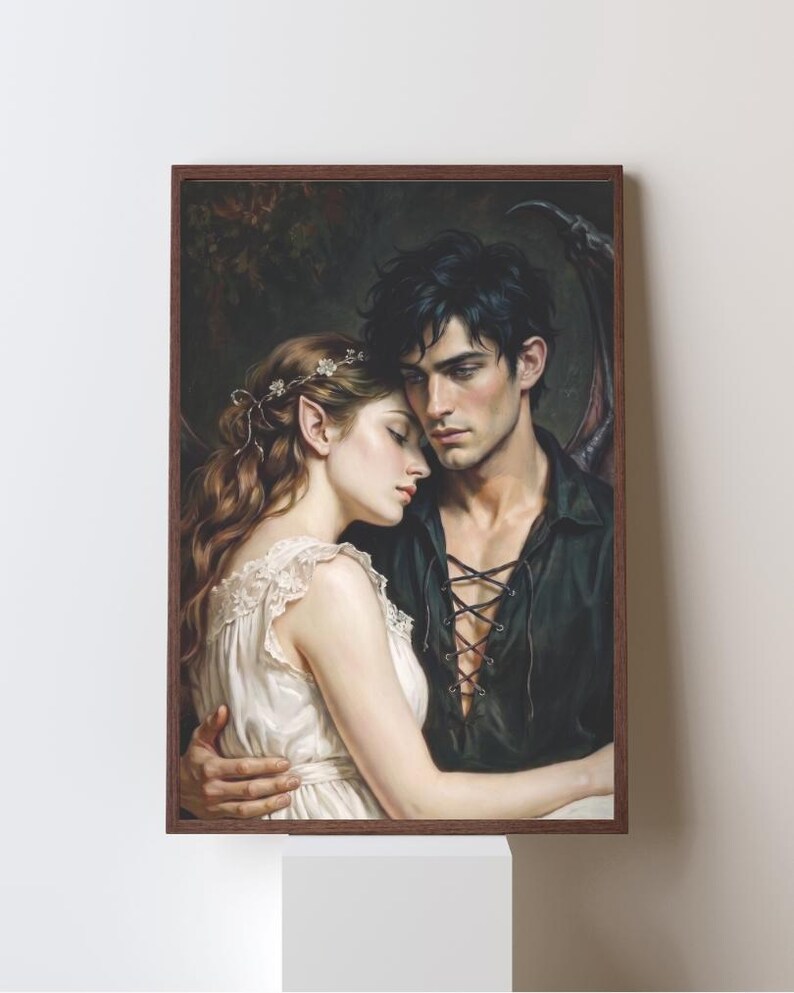 May include: A framed wall art print depicting a fantasy illustration of two figures embracing. One figure has long wavy hair with a floral accessory and pointed ears, wearing a white dress. The other figure has dark hair and wears a black lace-up shirt.