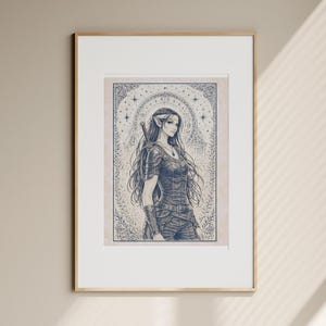 May include: Framed art print featuring a detailed illustration of a female elf warrior. The artwork is in shades of blue and gray, with intricate details in the clothing and background. The elf has long hair and a sword on her back. The print is in a gold frame.