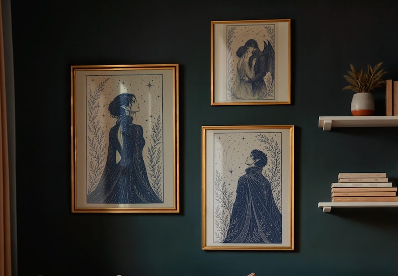 May include: Three framed art prints with gold frames hang on a dark green wall. The prints feature illustrations of figures in dark blue, with celestial and botanical elements. One print depicts a couple embracing, another a figure looking up, and the third a woman.