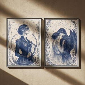 May include: Two framed art prints. The left print features a woman in a dark blue dress holding a harp. The right print depicts a couple embracing, with the man having dark wings. Both prints have a blue and cream color scheme.