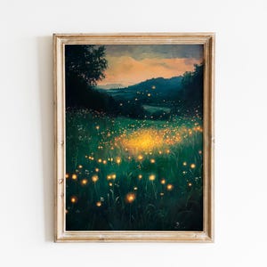 May include: A framed landscape painting depicts a field of glowing lights at dusk. The artwork features a dark green field with numerous yellow lights, a dark tree, and a mountain range under a colorful sky.