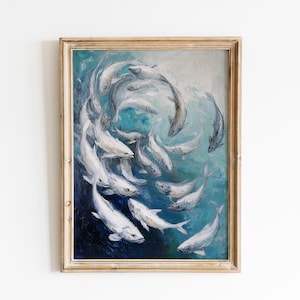 May include: An oil painting in a distressed wooden frame depicts a school of white fish swimming in a swirling pattern against a backdrop of blue and teal water. The artwork has a textured, painterly style.