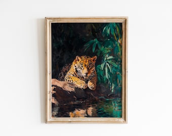 May include: Framed art print of a jaguar resting on a rock near water. The jaguar has a spotted coat with orange and black markings. The background features lush green foliage and dark shadows, creating a jungle scene.