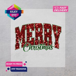 May include: A DTF transfer with the words "MERRY Christmas" in red glitter and green glitter script. The word "MERRY" is in a bold, collegiate-style font. The transfer is ready to press.