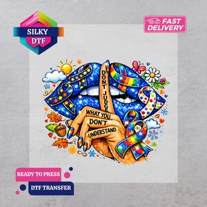 May include: A colorful DTF transfer featuring a design with blue lips, a hand making a 'shush' gesture, and the text "DON'T JUDGE WHAT YOU DON'T UNDERSTAND." The design includes ribbons and a butterfly. The transfer is labeled "SILKY DTF" and "READY TO PRESS."