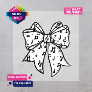 May include: A black and white bow design featuring musical notes and symbols. The bow is decorated with treble clefs, eighth notes, and sharp symbols. The image includes text that says "Silky DTF", "Fast Delivery", and "Ready to Press DTF Transfer".