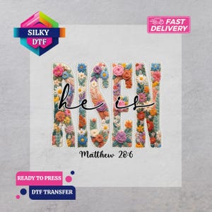 May include: A DTF transfer with the words "RISEN" and "he is" in a floral design. The text "Matthew 28:6" is below. The transfer features a colourful array of flowers in pink, blue, yellow, and orange.