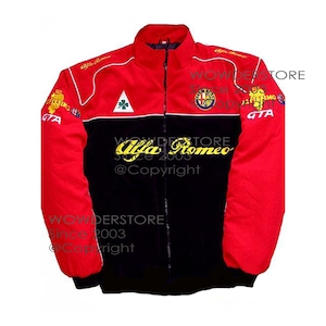 May include: A red, black, and white Alfa Romeo racing jacket. The jacket features a full zip, a stand-up collar, and various logos and text, including "Alfa Romeo" in gold script across the chest. The sleeves and upper body are red, the lower body is black.