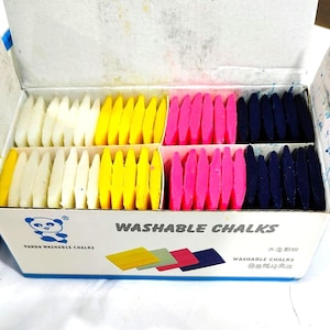 May include: A cardboard box containing rows of rectangular washable chalks in white, yellow, pink, and dark blue. The box features a panda logo, the text "PANDA WASHABLE CHALKS", "WASHABLE CHALKS", and additional text in Asian characters.