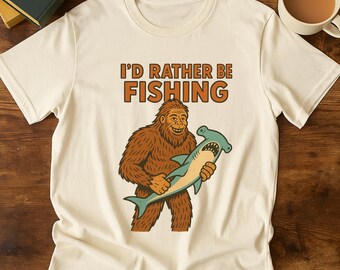 Grappig Bigfoot Fishing T-shirt – retro sasquatch met afbeelding van hamerhaaien