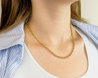 Mini collana con perline dorate