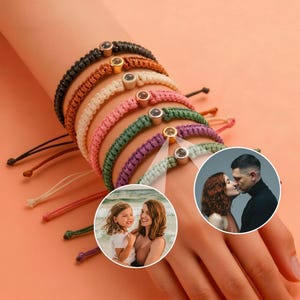 May include: A collection of handmade macrame bracelets in various colors, including black, brown, tan, white, pink, green, purple, and light green. Each bracelet features a central decorative element and adjustable ties. Two circular images are also included.