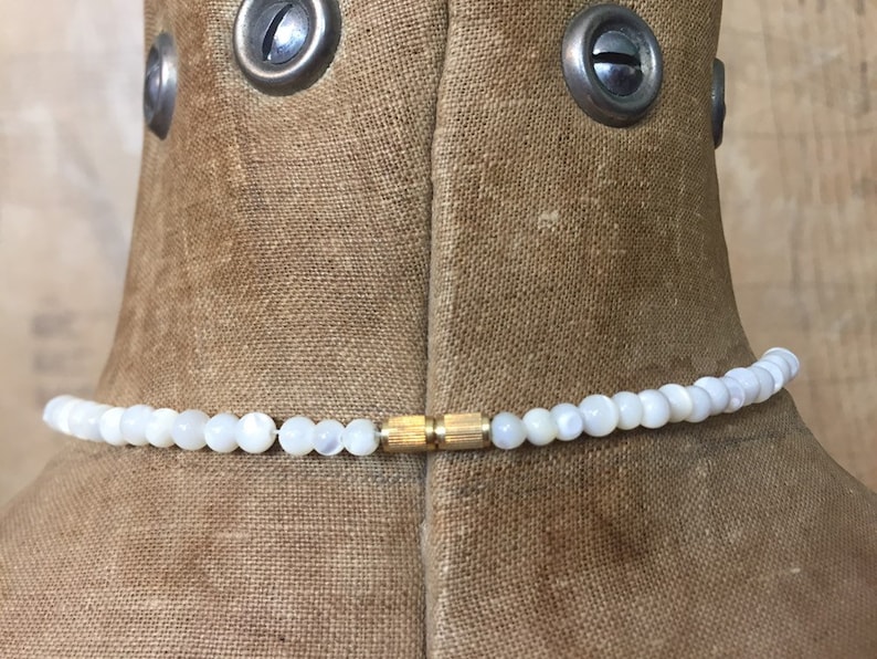 Circa 1950s The White Cats Eye Glass Bead Necklace Wonderful Light Catching Marbling