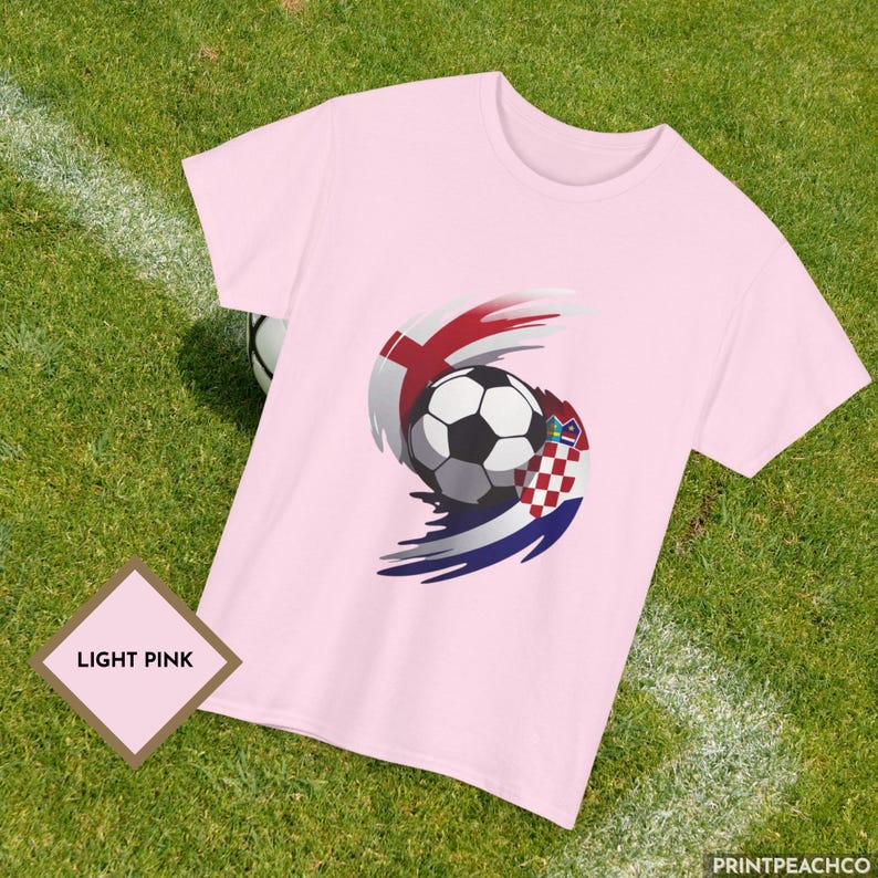 Light pink England vs Croatia soccer fan shirt with dynamic football and flag swirl design.