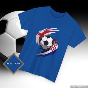 Royal blue England Croatia soccer shirt featuring swirling flag design around football.