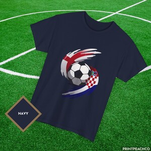 Navy England vs Croatia football fan shirt with bold flag swirl soccer ball design.