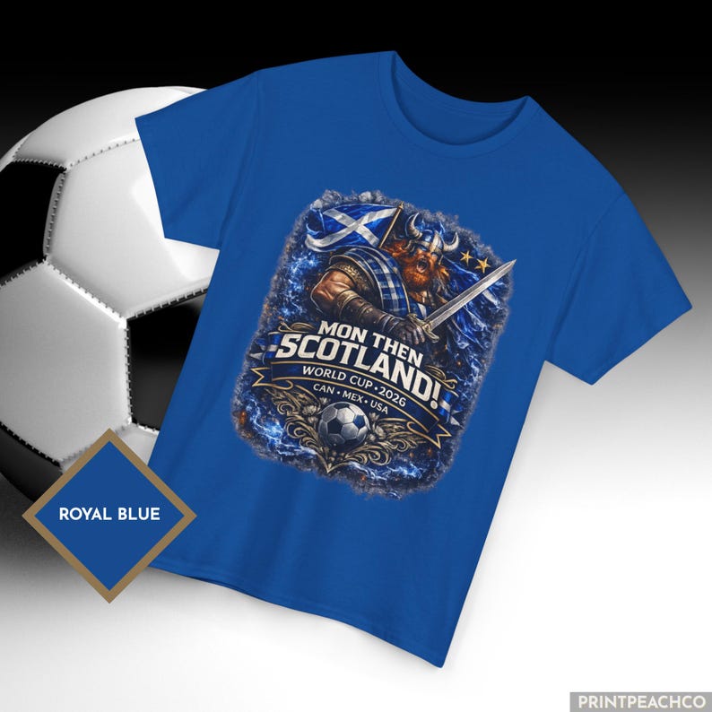 Royal blue Scotland World Cup 2026 shirt with Scottish football fan graphic