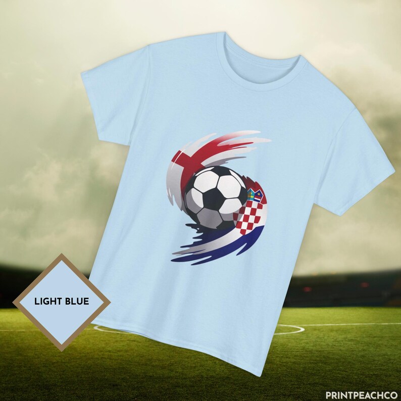 Light blue England Croatia World Cup football t-shirt with stylised red white and blue soccer graphic.