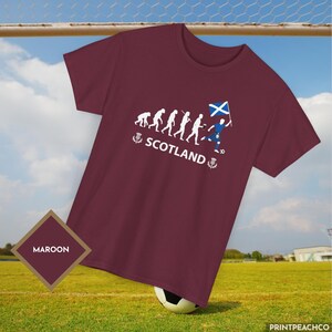 Scotland football fan shirt with evolution graphic and Saltire flag