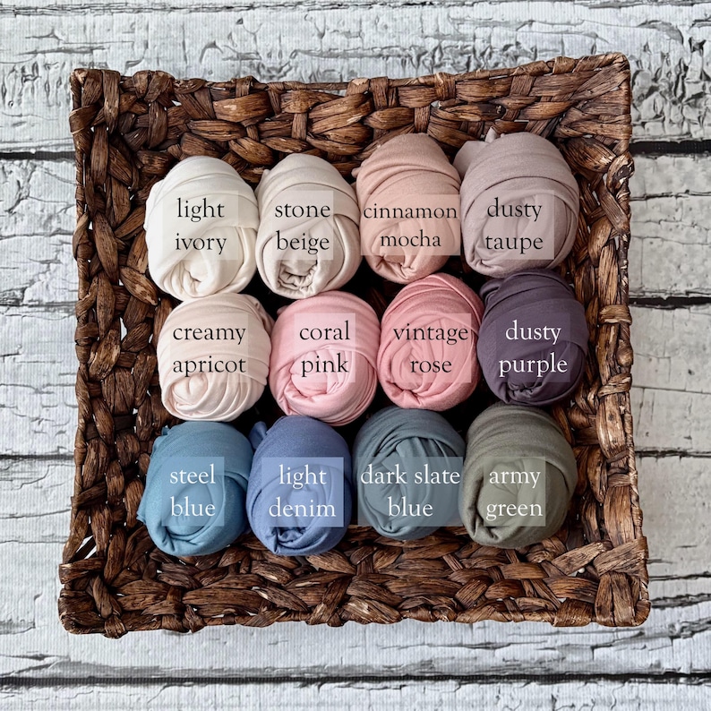 May include: A woven basket filled with rolled fabric in various colors. Colors include light ivory, stone beige, cinnamon mocha, dusty taupe, creamy apricot, coral pink, vintage rose, dusty purple, steel blue, light denim, dark slate blue, and army green.