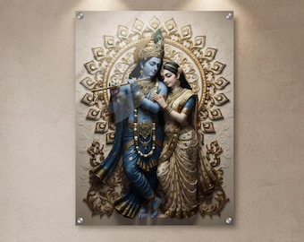 May include: A framed wall art piece showing a relief sculpture of two figures in traditional dress. The figures are in shades of blue, gold, and beige, set against a cream background with a gold decorative pattern. The artwork is mounted on a neutral-toned wall.