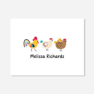May include: A white card with three cartoon chickens. The chickens are yellow, white, and brown. The rooster has a rainbow tail. The card says "Melissa Richards" at the bottom.