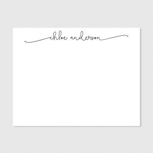 May include: A white card with a black cursive script that reads "chloe anderson" at the top.