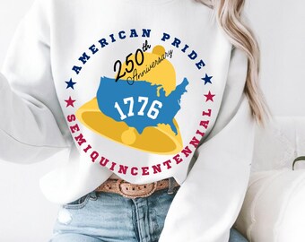 May include: White sweatshirt with a graphic celebrating the 250th anniversary of 1776. The design features a blue map of the United States, a yellow bell, and the words "American Pride" and "Semi-quincentennial" in a circular arrangement.