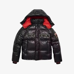 May include: Black puffer jacket with a hood and red lining. The jacket features the text "Avi rex" in white and black lettering across the chest. A small patch is visible on the right sleeve.