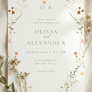 May include: Wedding invitation with floral border. The invitation reads "Kindly join us for the wedding of Olivia and Alexander" with the date August 20th at 5 PM. The invitation includes the address 123 Anywhere St., Any City, ST 12345.