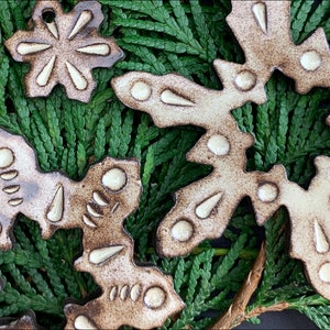 signed SNOWFLAKE ORNAMENTS | black clay ceramic, creamy shino glaze, 6 patterns, no two alike | window wall hanging | FREE* shipping promo
