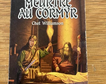 May include: A paperback book titled "Meurtre Au Cormyr" by Chet Williamson. The cover features illustrations of two figures, one holding a torch and the other a staff, with a figure lying on a table. The book is part of "Les Royaumes Oubliés" series.