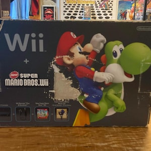 CONSOLE : Wii Deluxe Super Mario Bros Bundle | 100% Authentic | Includes 2 x controllers + wheel + Super Mario Bros (CIB) | Works perfectly