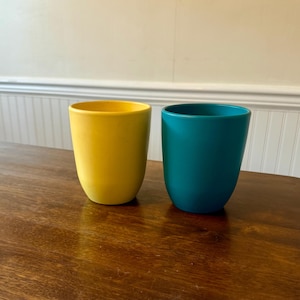 May include: A rustic wooden sign with the text "Welcome to our home" in white lettering. The sign features a distressed finish and a simple, inviting design, perfect for a front porch or entryway.