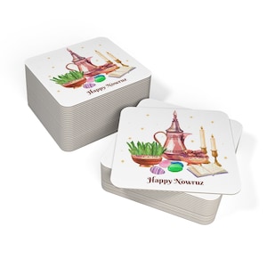May include: A stack of square coasters with a watercolor design. The design includes a copper teapot, candles, a bowl of sprouts, and the text "Happy Nowruz". The coasters have a white background.