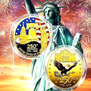 May include: Two commemorative coins with gold and colorful designs, featuring the Statue of Liberty and fireworks in the background. One coin displays the Liberty Bell, the Capitol, and the text "250th Anniversary 1776-2026". The other coin shows an eagle and the White House.
