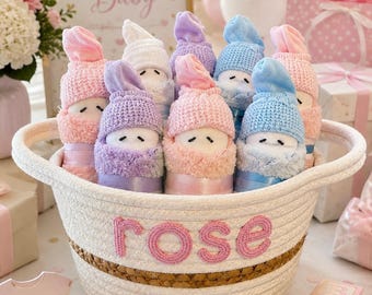 10 Diaper Babies in a basket white.  Personalized with hand crochet. Filled with diaper essentials. Makes great baby shower gift.
