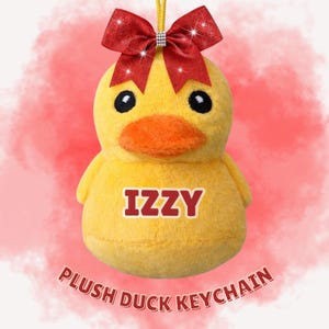 May include: A plush yellow duck keychain with the name "IZZY" in red letters. The duck has an orange beak and a red glitter bow. The text "PLUSH DUCK KEYCHAIN" is at the bottom.