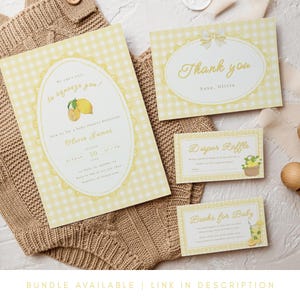 May include: A set of baby shower invitations and cards with a lemon theme. The invitations feature a yellow gingham pattern and include text such as "to squeeze you" and "Olivia James." Additional cards say "Thank you," "Diaper Raffle," and "Books for Baby."