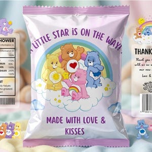 May include: A baby shower favour bag with a pink and purple design. The bag features Care Bears on a cloud with a rainbow. Text on the bag reads "A Little Star is on the Way!" and "Made with Love & Kisses."